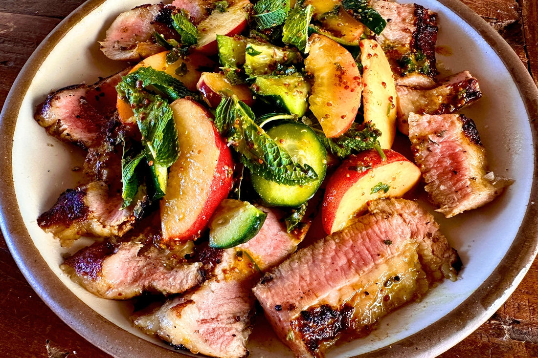 Grilled Marinated Ibérico Secreto with Peach & Cucumber Salad