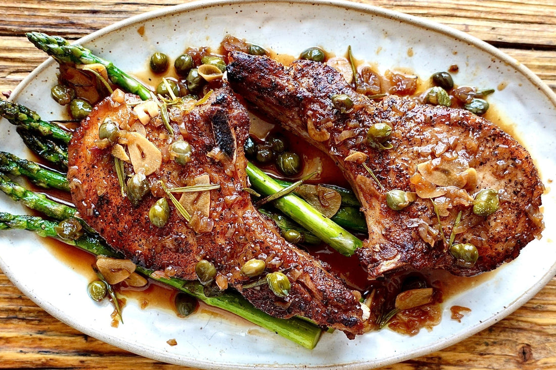 Easy Grilled Ibérico Pork Chops with Garlic Caper Sauce & Asparagus