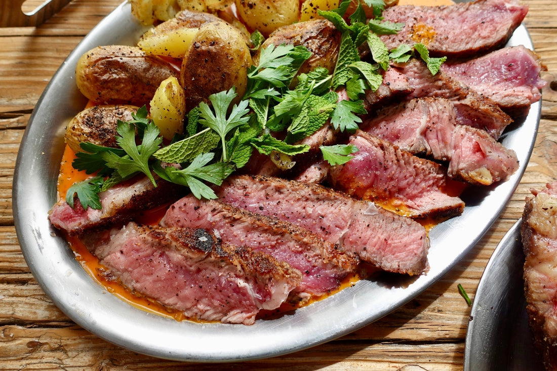 Basque-Style grilled Vaca Vieja Bone-In Steak with fire-roasted romesco & crispy baby potatoes