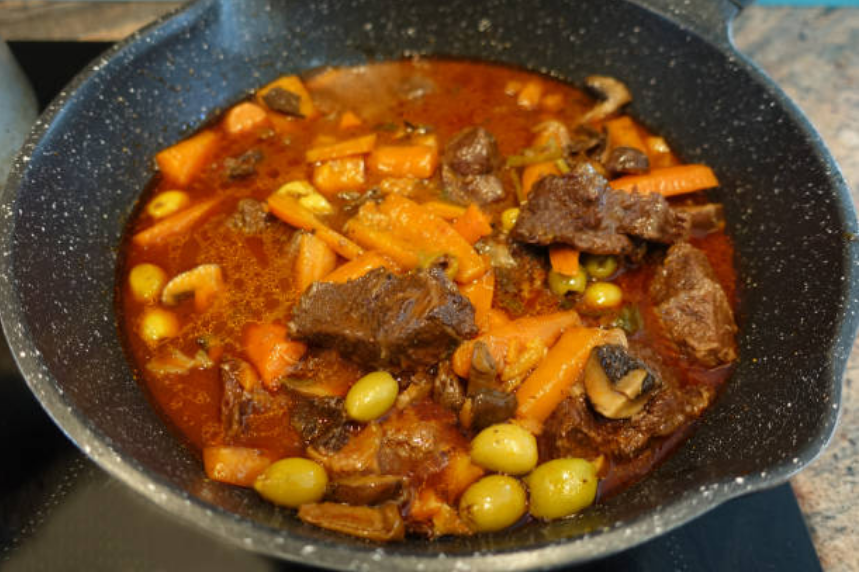 Braised veal with wine and olives