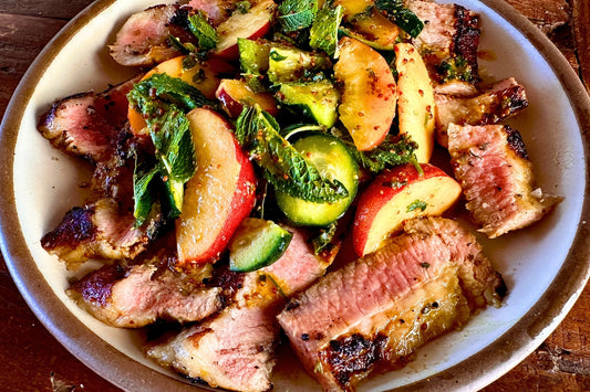 Grilled Marinated Ibérico Secreto with Peach & Cucumber Salad