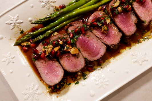 Orange-Glazed Ibérico Tenderloin with Pomegranate Tapenade & Asparagus