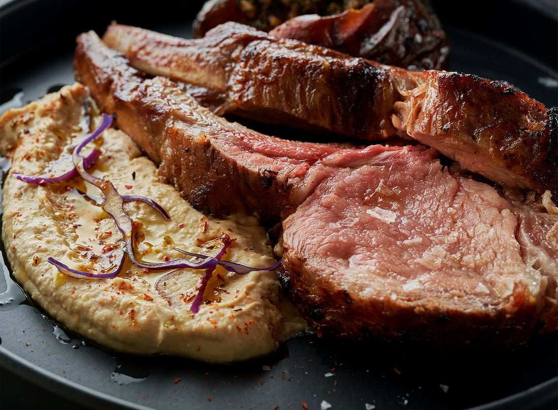 Grilled 4 Rib Rack with Hummus, Sweet Potatoes, and Chimichurri