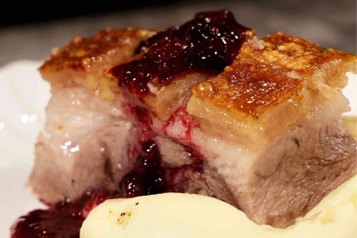 Crispy Ibérico Pork Shoulder with Cranberry Raspberry Sauce and Mashed Potatoes