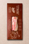 Package of sliced Ibérico uncured pork bacon with red meat and white fat visible through window on brown box.