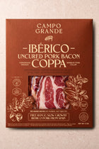Sliced Ibérico coppa bacon package showing marbled red and white meat slices on russet-colored label.